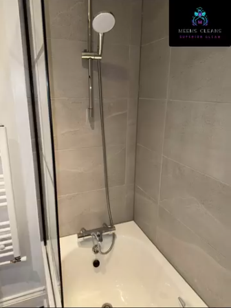 Freshly cleaned bathroom shower and bath