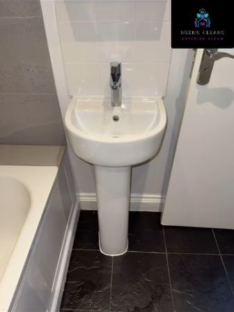 Polished bathroom basin and tiled floor